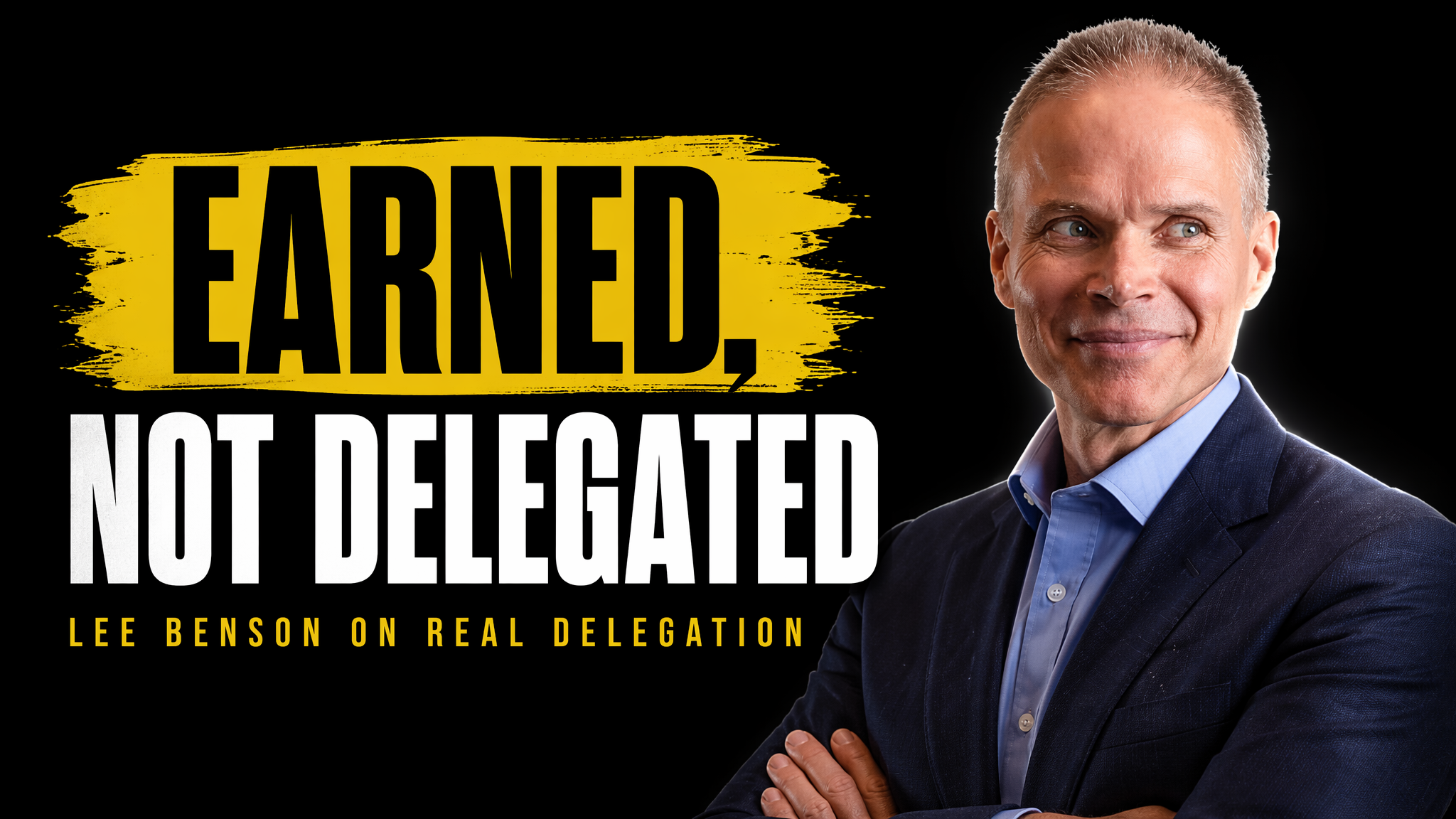 Professional man in blue blazer and light blue shirt, smiling at camera against black background with yellow "Earned, Not Delegated" text overlay.